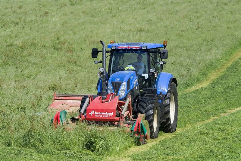 New Holland T7 tractor with Kvernland front and side mower conditioner