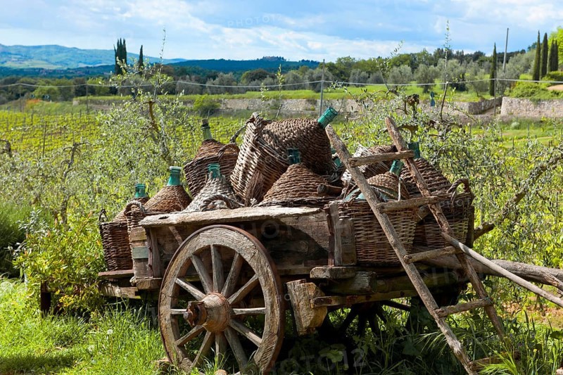 Wooden cart with wine bottles