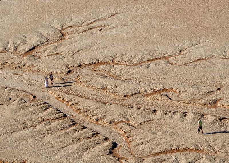 Three people in the desert