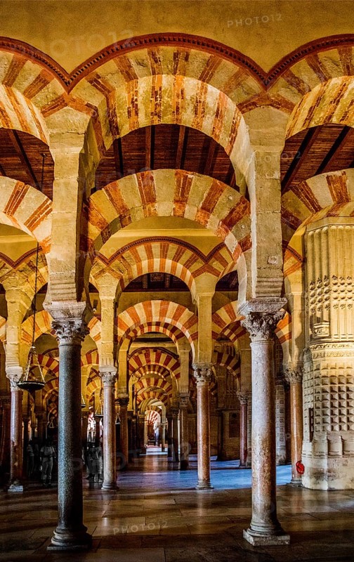 Forest of columns with alternating use of brick and stone and red and white paint