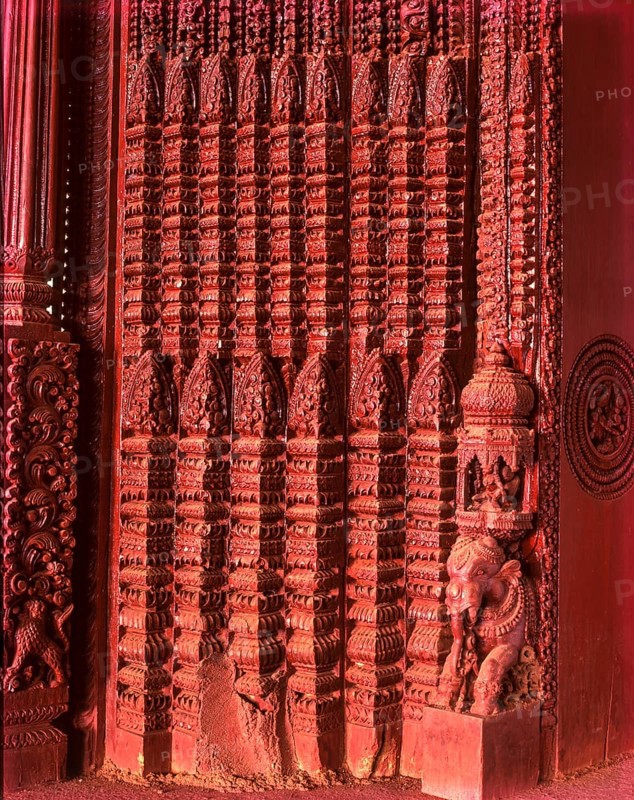 Richly carved wooden door of an old house portal in kanadukathan