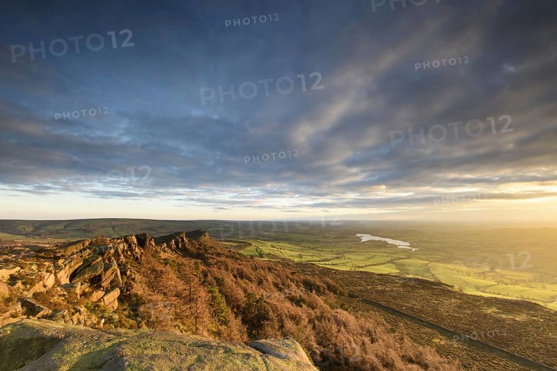 View of the Gritstone escarpment in the afternoon sun
