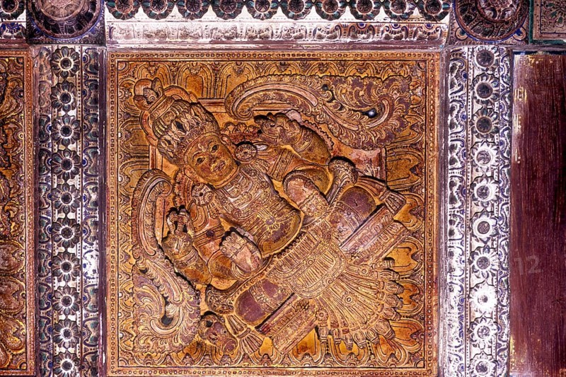 Wood carvings on the ceiling in thousand years old Avittathur Siva temple near Thrissur or Trichur