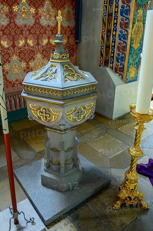 Baptismal font with candle