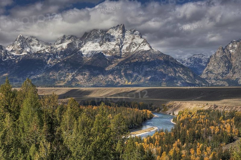 View of mountain range and forested river valley
