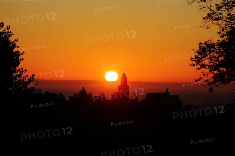 View of the silhouette of Kronberg Castle at sunrise in Kronberg