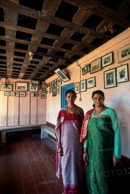 Kodava Women standing in her traditional home in Kodagu
