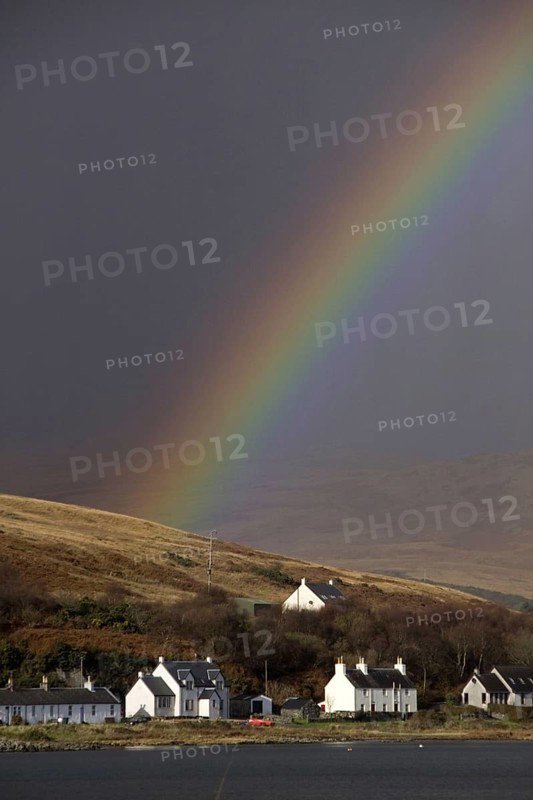 Rainbow over the houses on Craighouse Island Jura