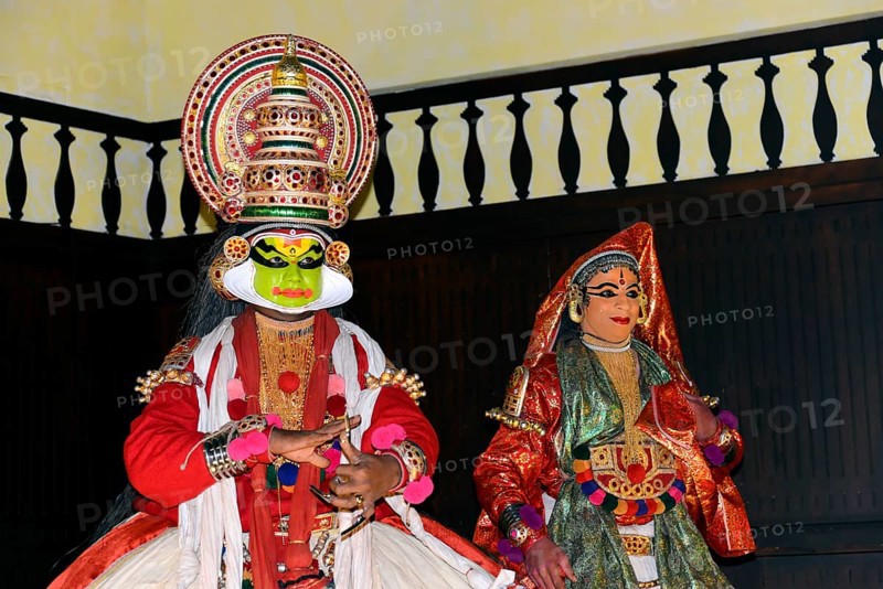 Fully made up and costumed Kathakali dancers performing