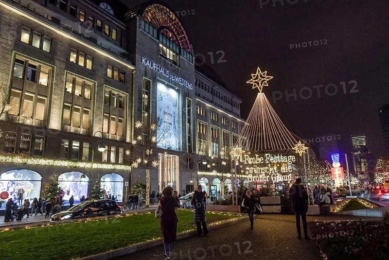 Kadewe from outside in the glow of lights. Christmas shopping on Tauentzien am Schoeneberg