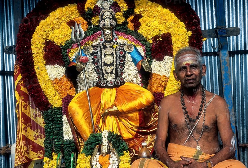 Decorated god with priest
