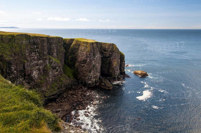 View of Torridonian red sandstone sea cliffs in northwest of island