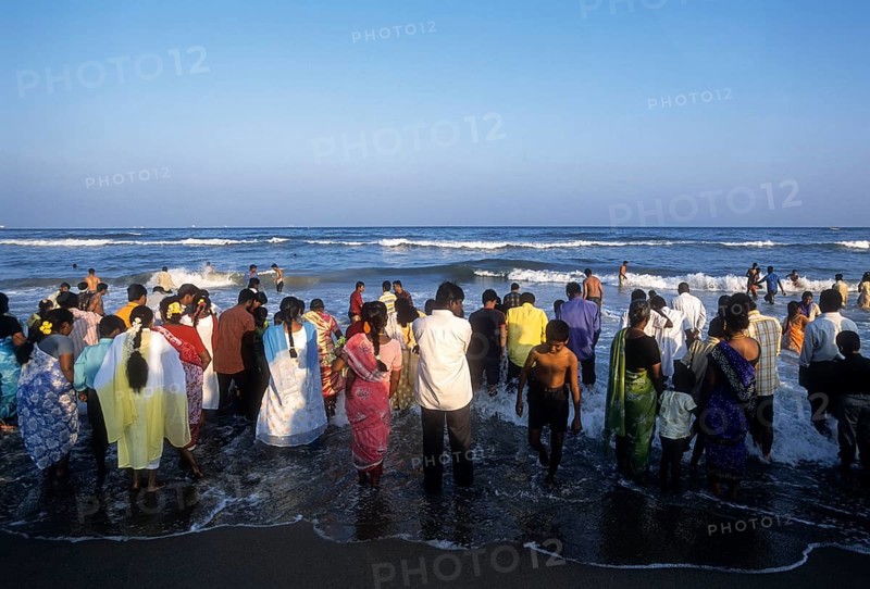 People enjoying in sea water at Marina beach in Chennai