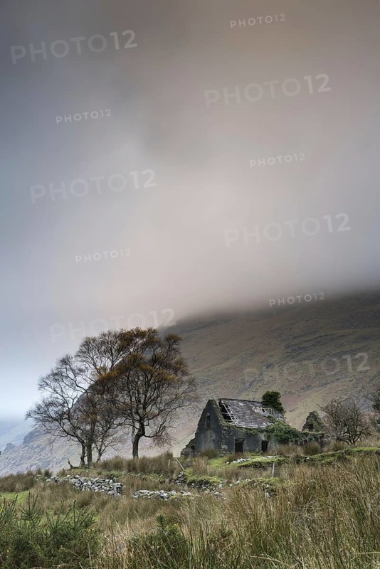 View of drystone walls and abandoned farmhouse