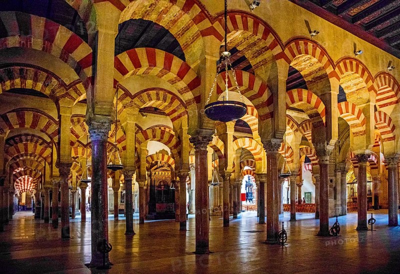 Forest of columns with alternating use of brick and stone and red and white paint