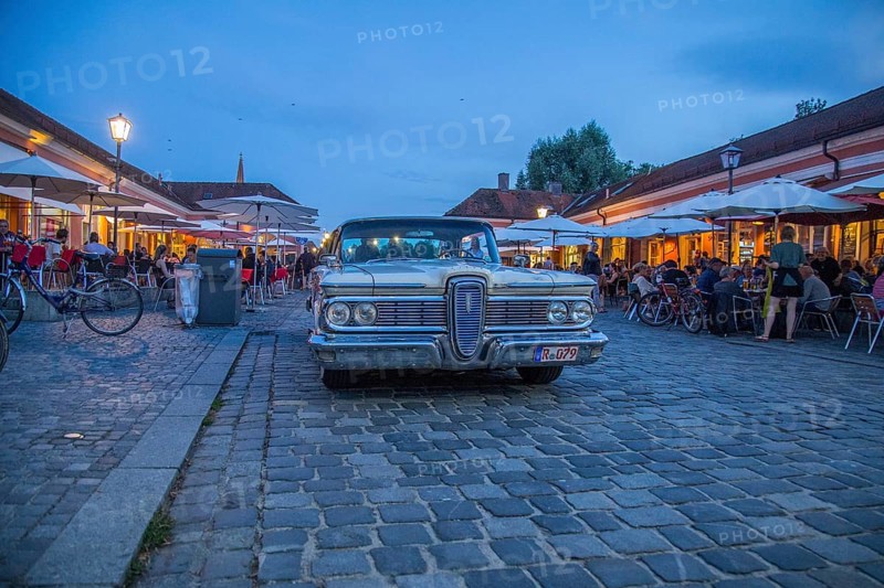 Evening scene in the Stadtamhof nightlife district with US street cruiser as eye-catcher