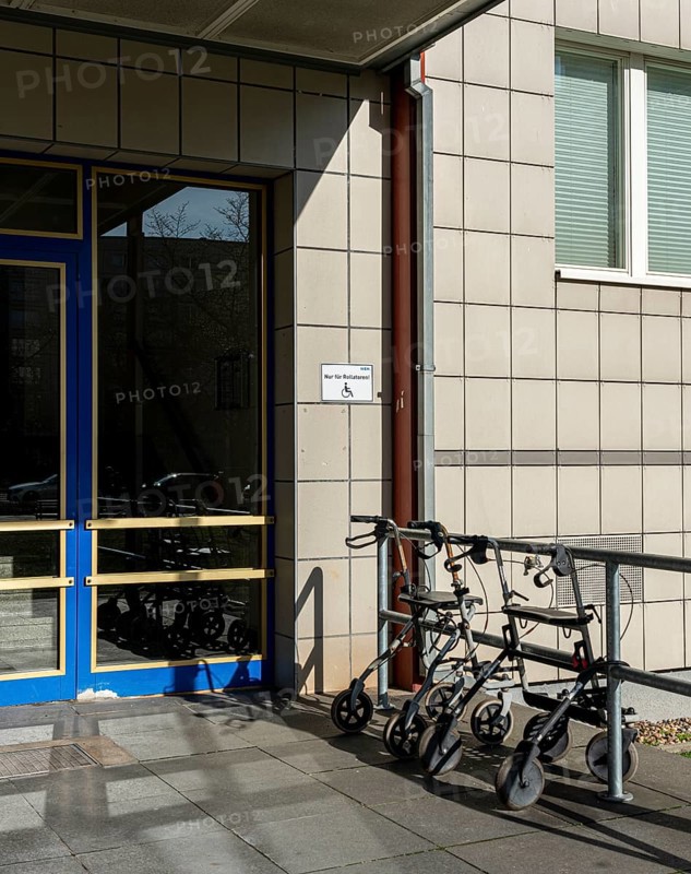 Rollator in front of the entrance to an apartment building in Berlin Mitte