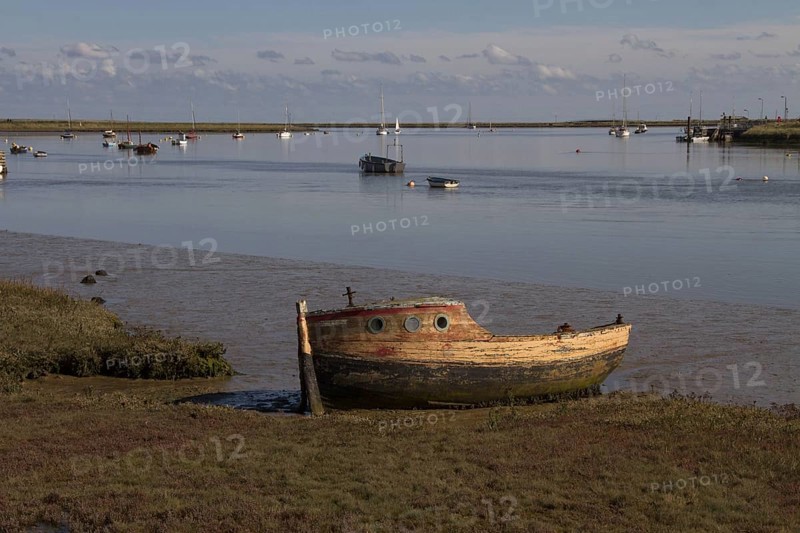 Abandoned boat on the tidal flats of the River Ore near Orford