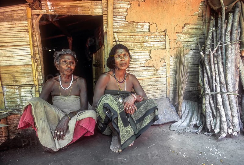 Mudunga tribal women sitting in front of the hut a tribal village near Silent Valley