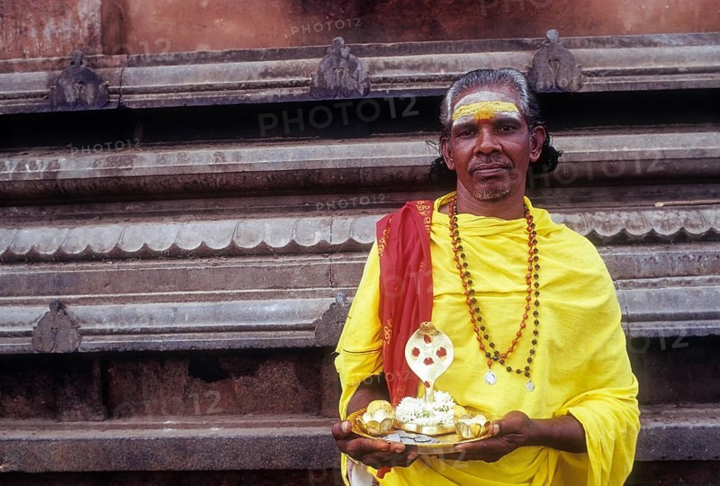 V. Moorthy â€“ Beggar standing with idol naga