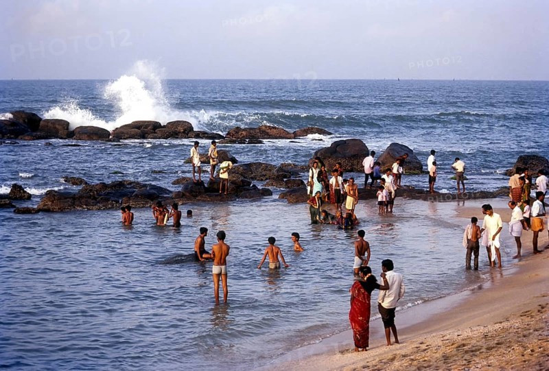 People enjoying in sea water along the shores of the three oceans at kanyakumari