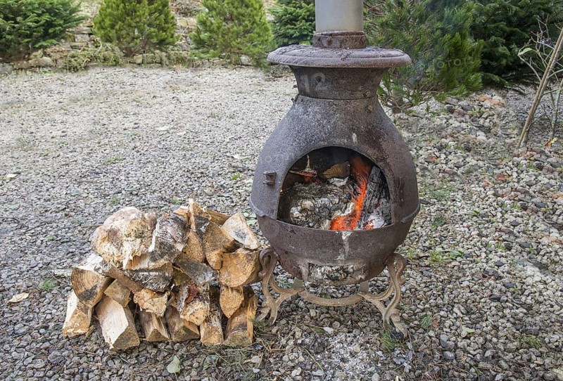 Wood stove burning split logs