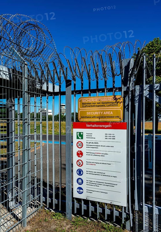 Fence with barbed wire at the security area of an airport