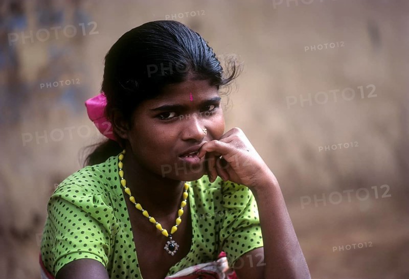 Betta Kurumba tribal girl sitting the tribal village