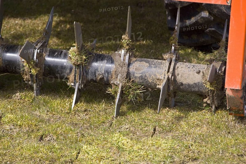 Aerating a field with a rotavater with knives to cut the soil