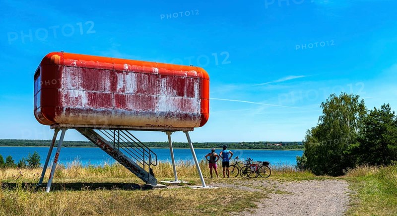 Red container at the lake that serves as a viewing platform