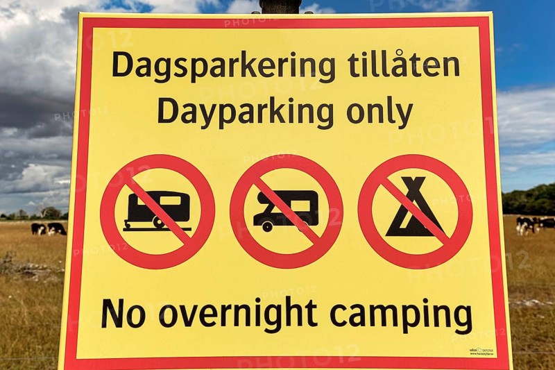 Yellow sign with inscription Parking only during the day