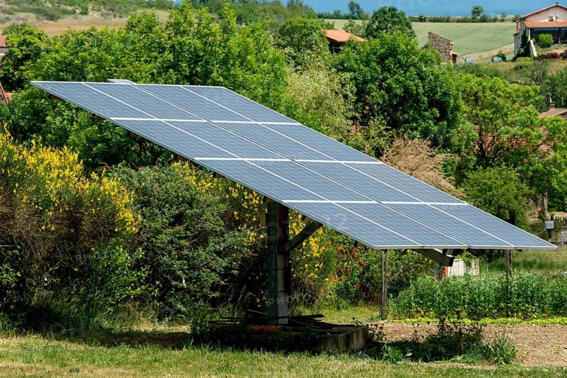 Solar panels in a garden. Auvergne Rhone Alpes. France