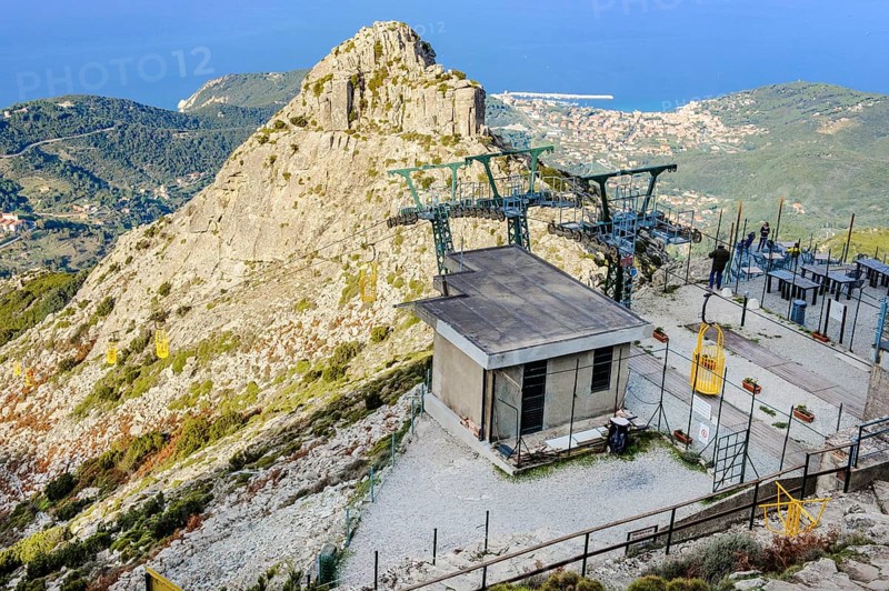 Mountain station of cable car Cabinovia Monte Capanne with open gondola cable car gondola standing gondola on mountain Monte Capanne