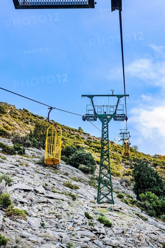 Ropeway Cabinovia Monte Capanne with open gondola Ropeway gondola standing gondola on mountain Monte Capanne