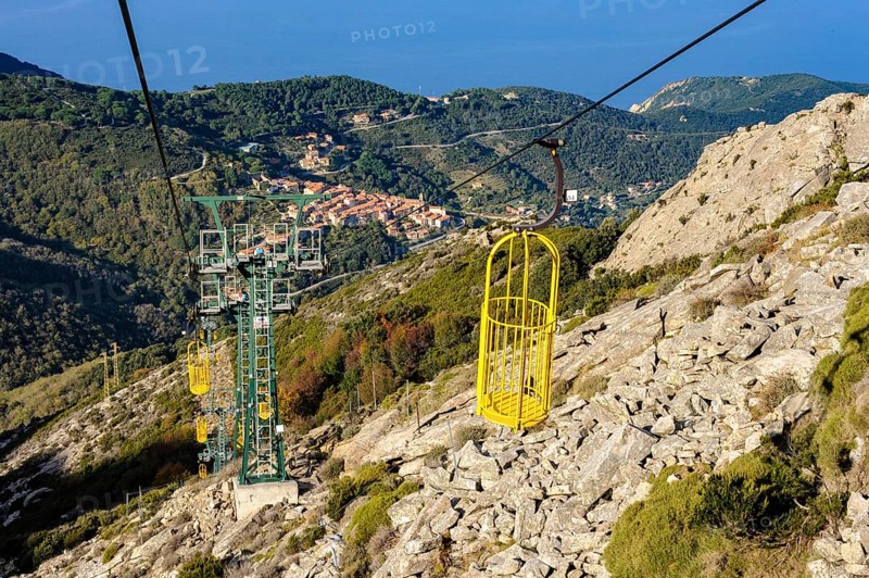 Cable car Cabinovia Monte Capanne with open gondola Cable car gondola standing gondola on mountain Monte Capanne