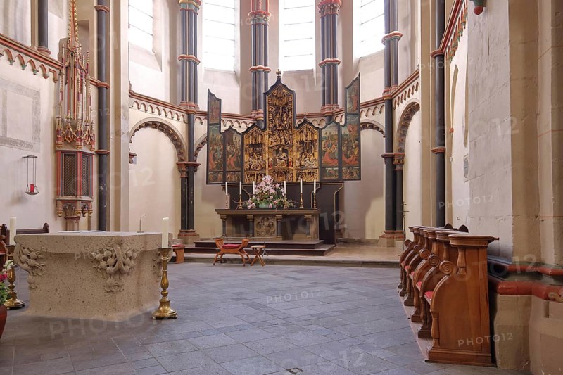Chancel with folding altar and high altar in the Gothic collegiate church of St. Martin and St. Severus in Muenstermaifeld