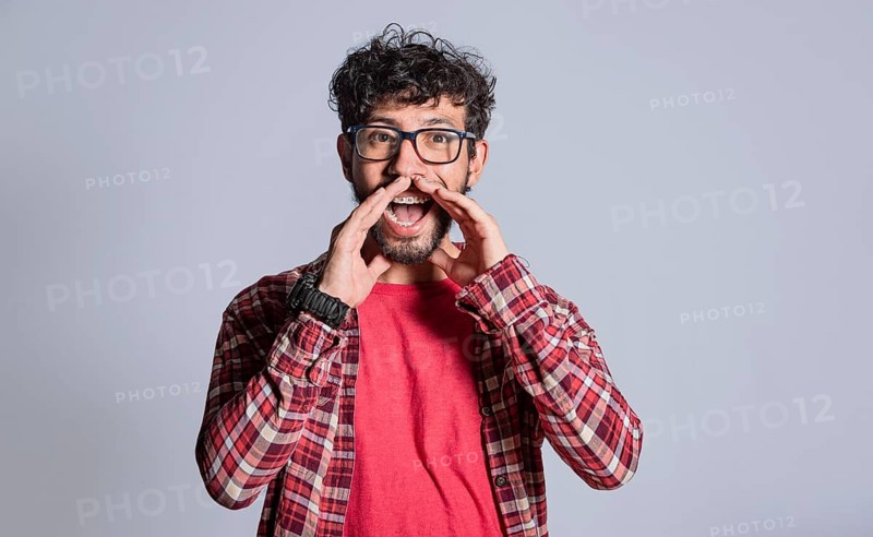 Person announcing and shouting with hands. Attractive man announcing and shouting with hands