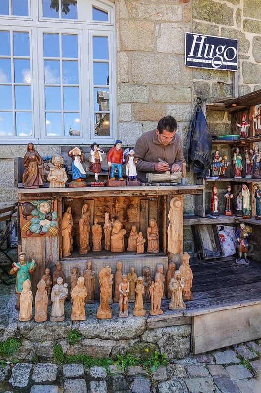Carvers of Breton figures in the village square