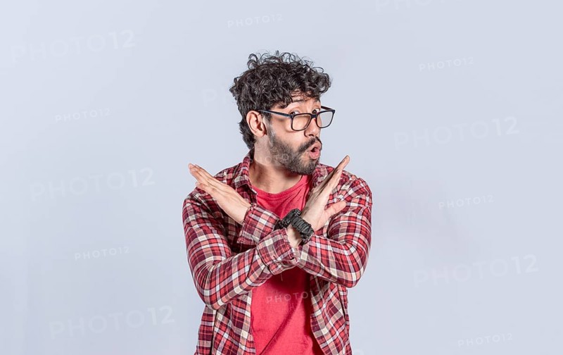Handsome man crossing arms in rejection