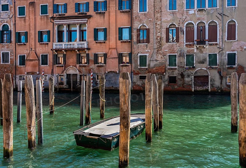 Wooden pegs for anchoring in the canals of the lagoon city of Venice