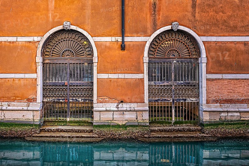 Entrance gate to a residential building on the Grand Canal in the lagoon city of Venice