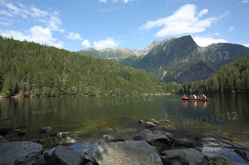 Rowing boat on the Piburg Lake with view of Acherkogel 3007m in Oetz