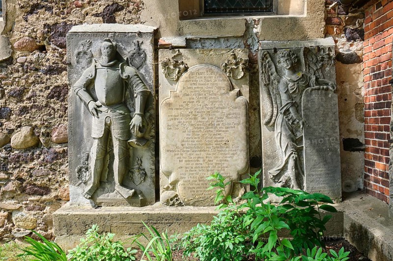 Figure gravestone and sandstone epitaph with angel figure
