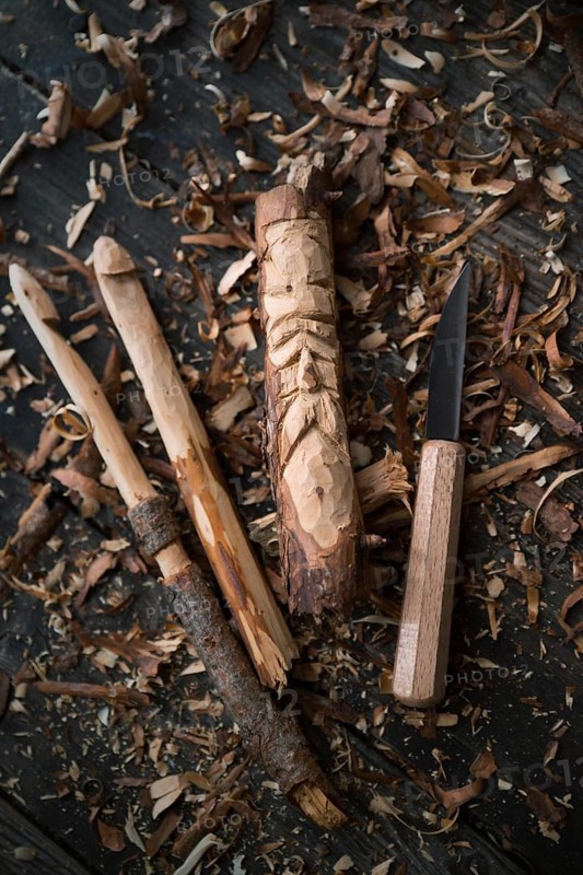 Carved crochet hook and face of an old man