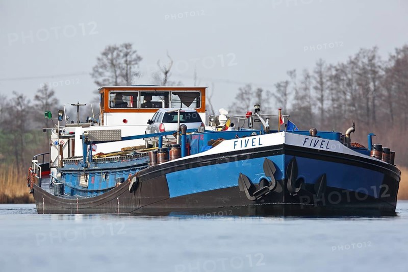 Fully loaded Dutch cargo ship Fivel on the river Peene