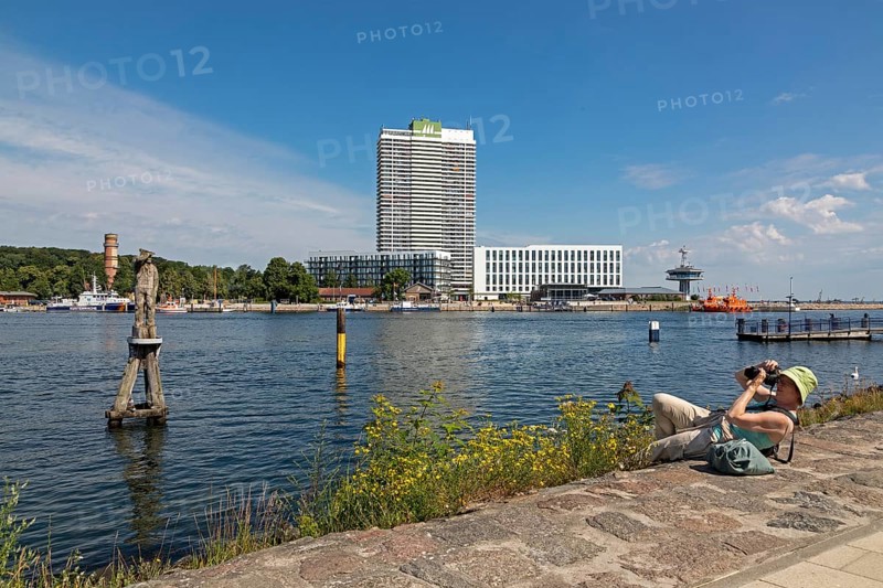 Woman lying on the ground and taking pictures