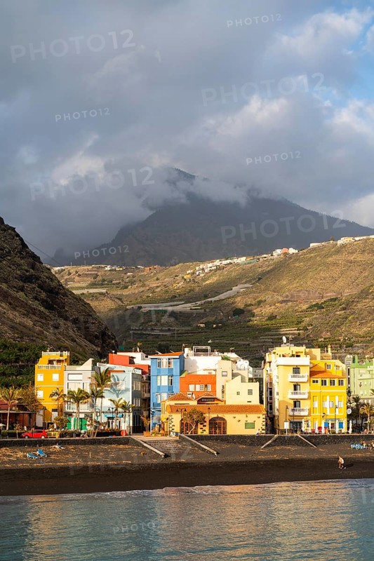 Lava beach and colourful houses in Puerto de Tazacorte