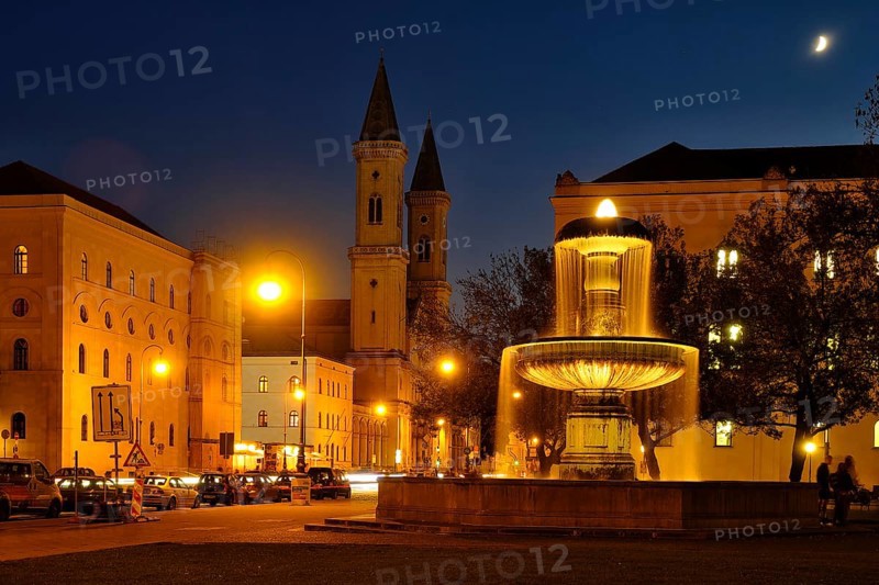 Illuminated fountain of the University and Church of St. Ludwig