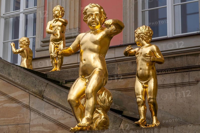 Golden figures on angel's staircase in front of Potsdam City Palace