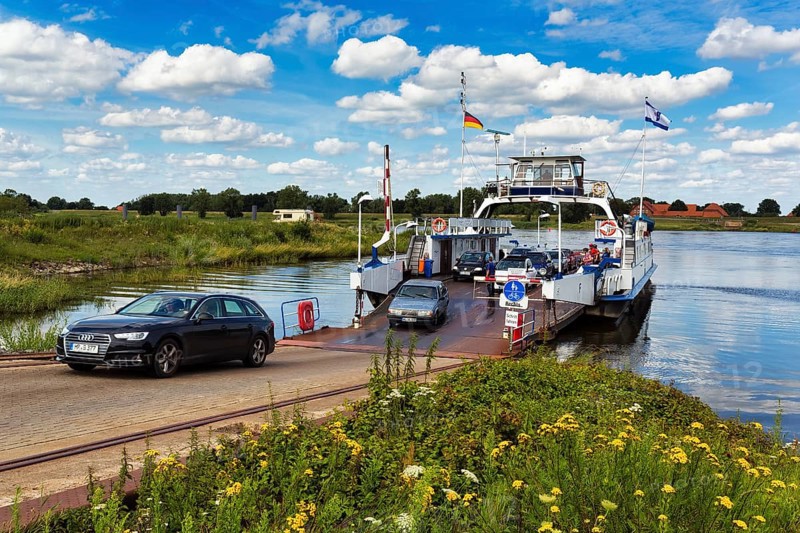 Cars drive off ferry